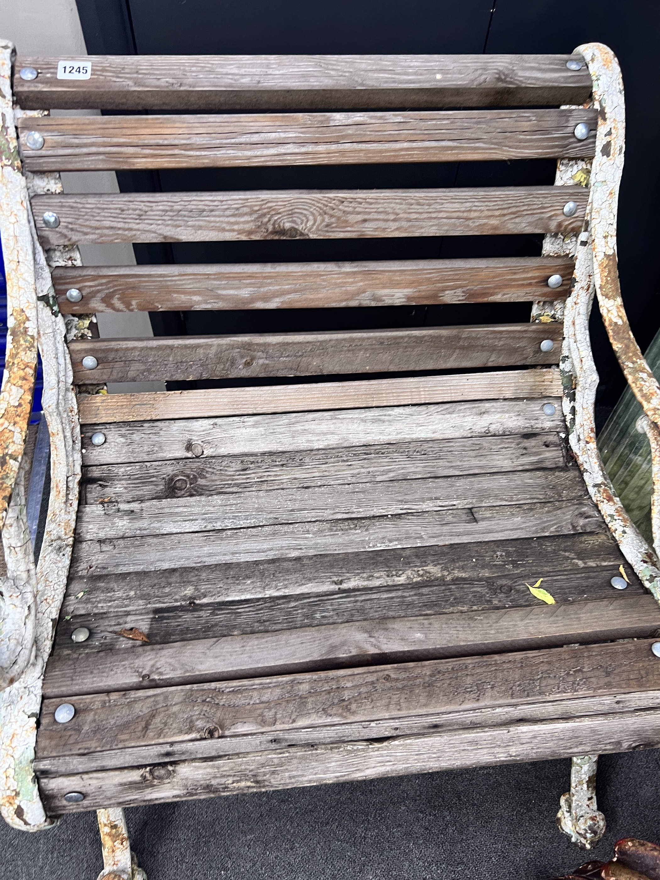A Victorian painted cast iron slatted garden seat, reduced, width 67cm, depth 64cm, height 76cm